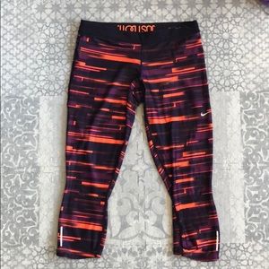 Purple & orange Nike women’s workout pants.